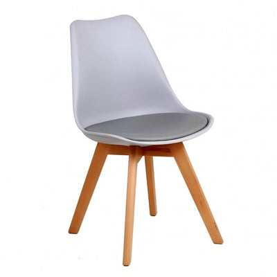 Silla Catarina con asiento tapizado en vinipiel, concha de polipropileno y patas de madera de haya